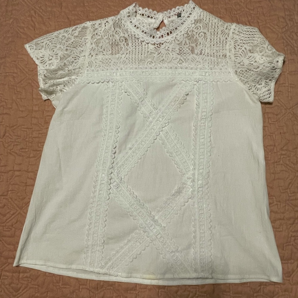 Large white top fits like a medium. Bought from Jane. Worn twice